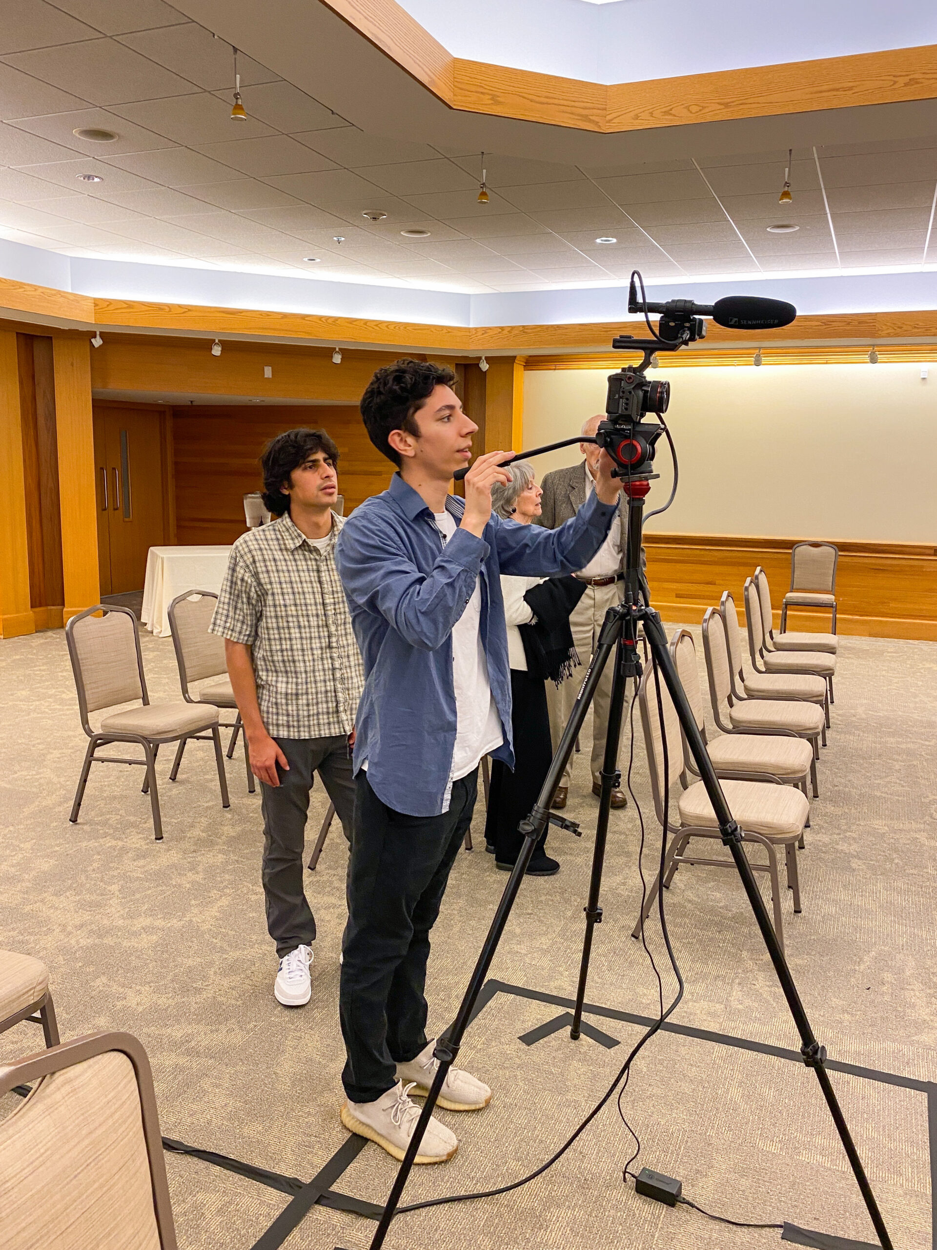 behind the scenes of camera crew at event