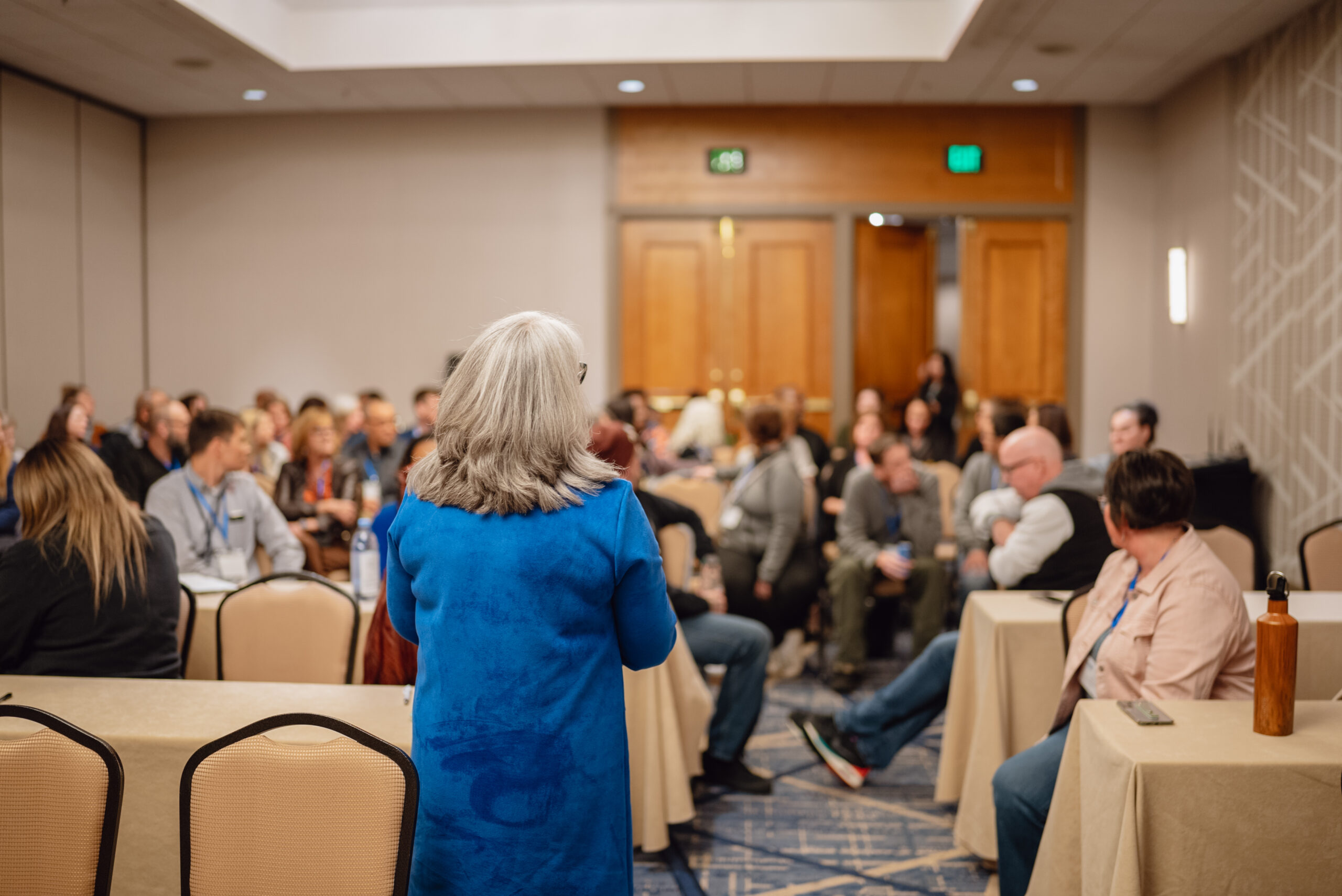 person standing in front of crowd at event